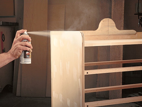 Spraying a finish on a smoothed cabinet case